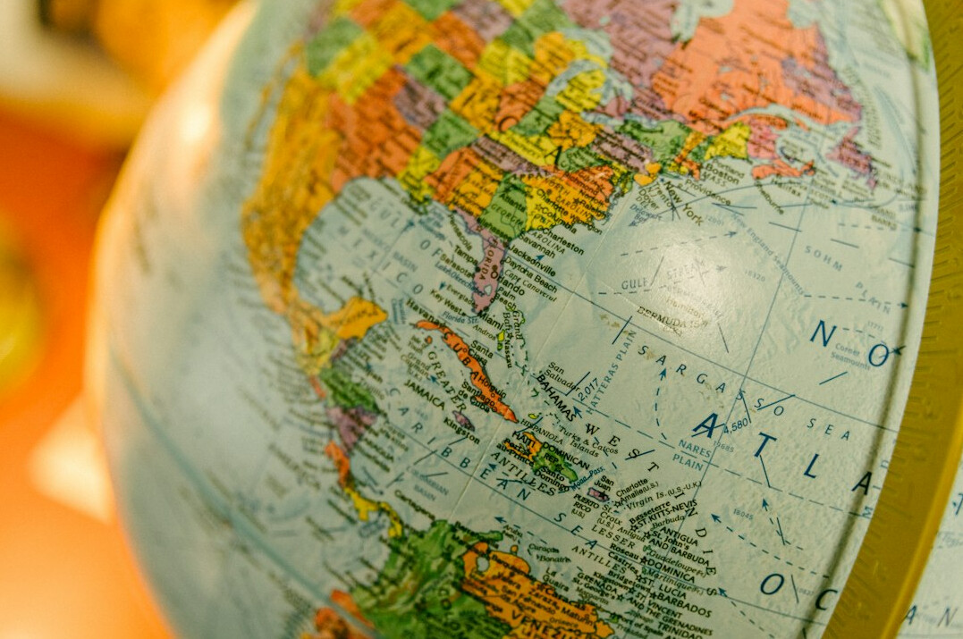 World globe and map on a desk