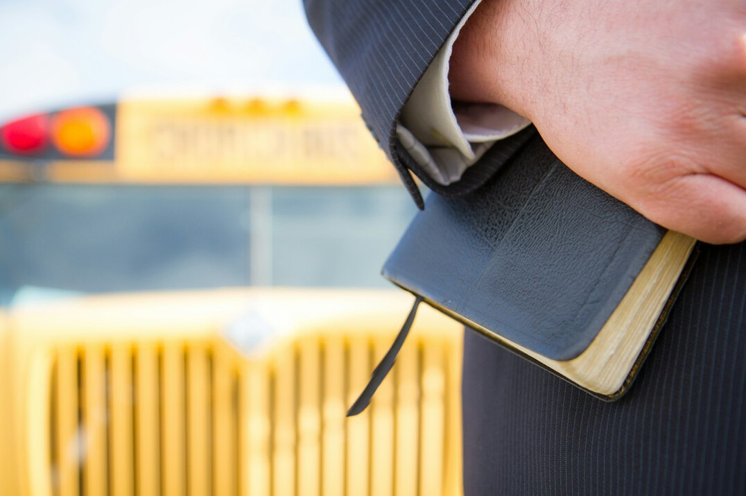 Reporter interviewing a source with a notebook in hand